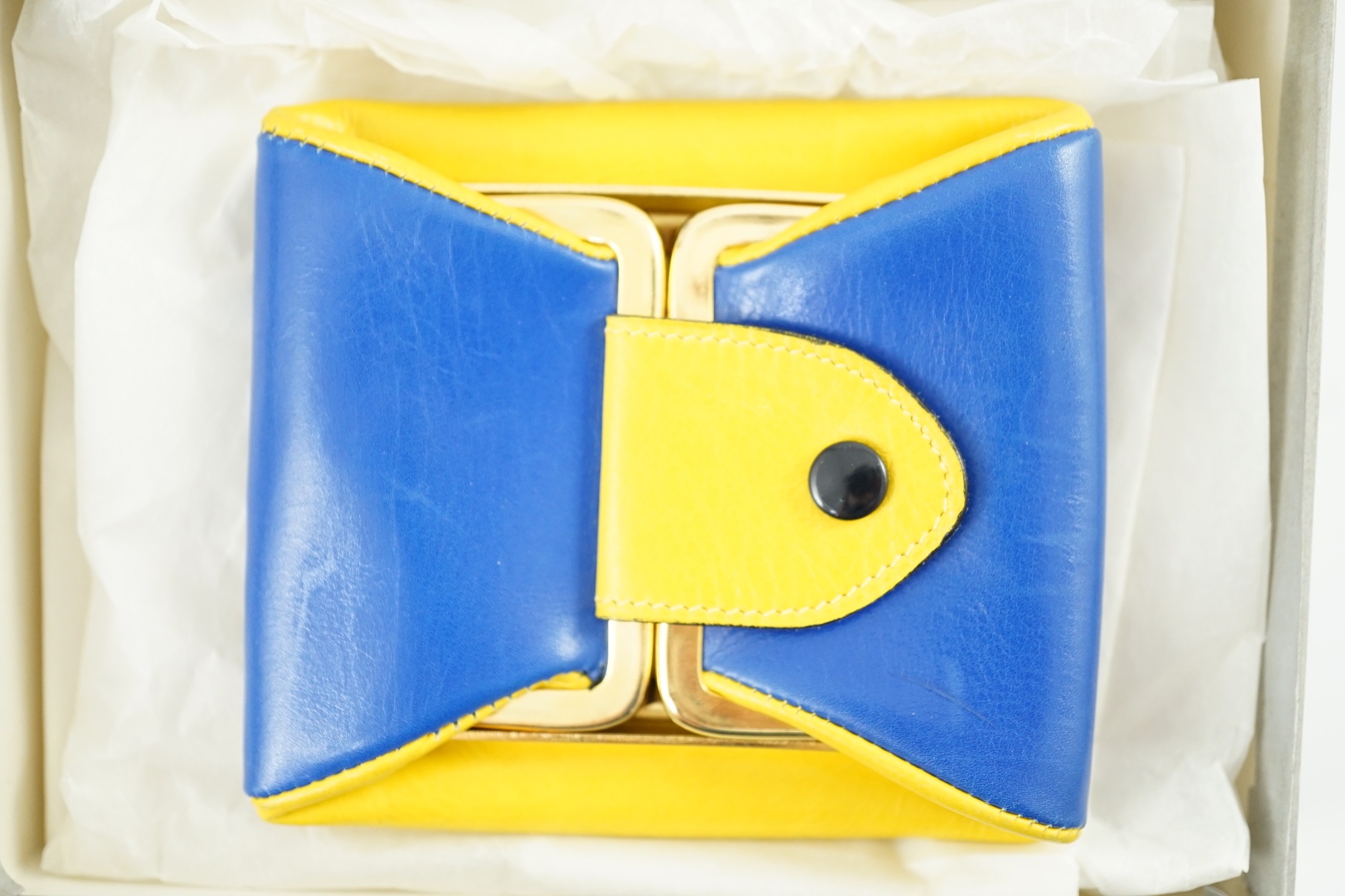 A boxed Gucci yellow and blue leather purse, 9 cm.